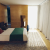 Zelený pléd Kave Home Odelna 130 x 170 cm -fv-interier-25