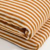 Pruhovaný oranžovo-bílý polštář na lehátko kave home Dirome 50 x 175 cm -fv-interier-25
